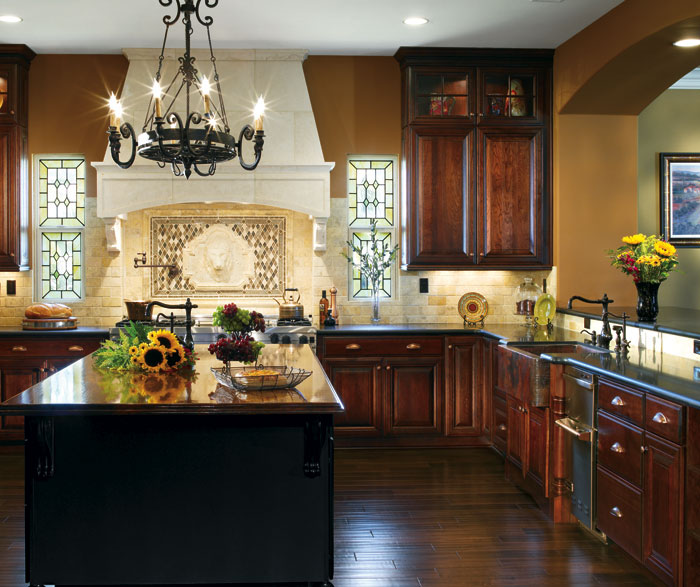 Dark Cherry cabinets in a traditional kitchen by Decora Cabinetry